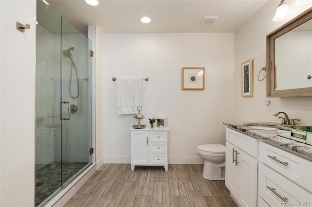 bathroom featuring a stall shower, visible vents, and vanity