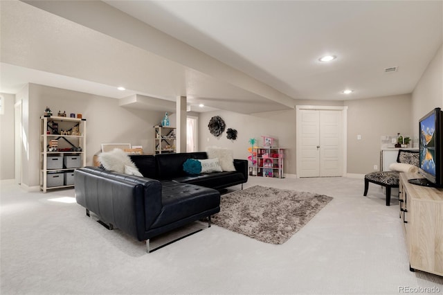 living area featuring recessed lighting, light carpet, visible vents, and baseboards