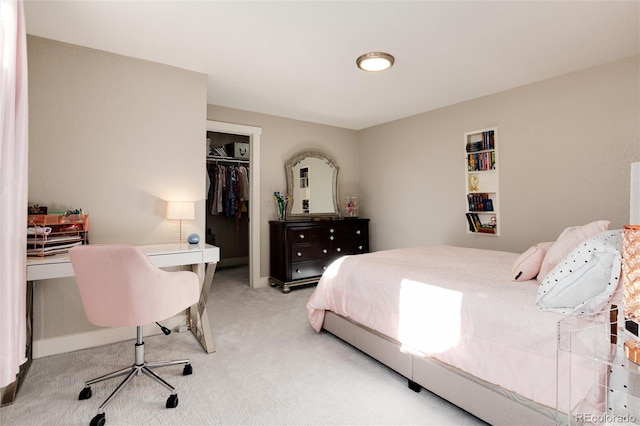 bedroom featuring a closet and light carpet