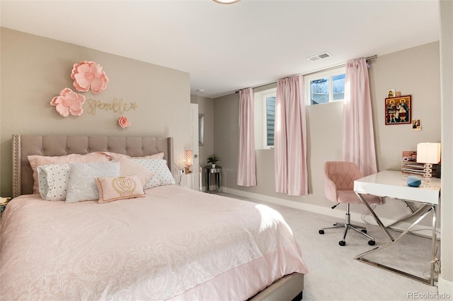 bedroom with carpet, visible vents, and baseboards