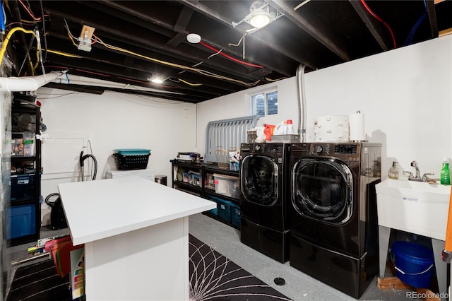 washroom featuring washer and dryer and laundry area