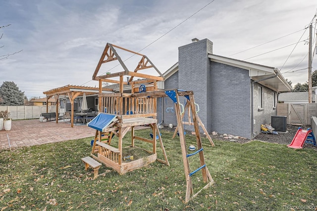 view of play area featuring a patio, a fenced backyard, central air condition unit, a lawn, and a pergola