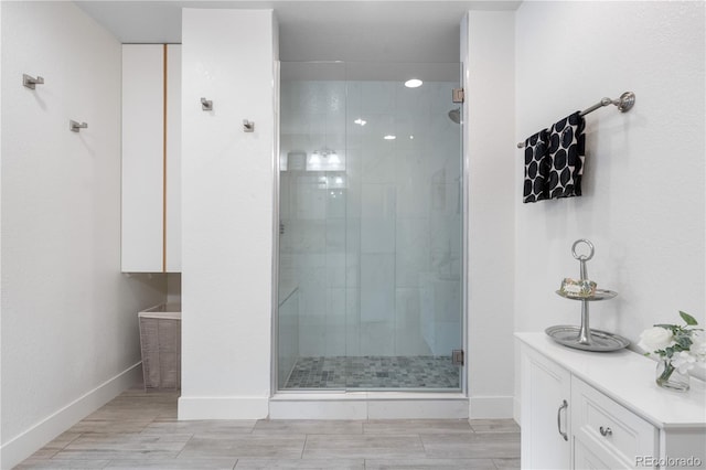 7155 E Exposition Ave, Denver, CO 80224 - full bath with a stall shower and wood finished floors