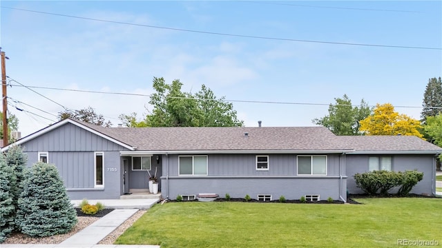 7155 E Exposition Ave, Denver, CO 80224 - single story home with a front lawn, roof with shingles, and brick siding
