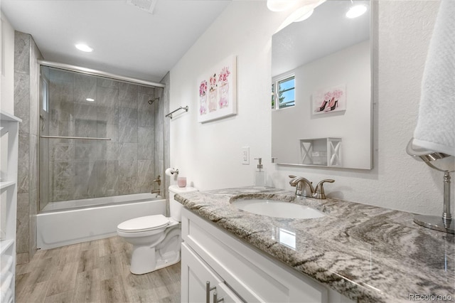 7155 E Exposition Ave, Denver, CO 80224 - full bath with vanity, wood finished floors,  shower combination, and recessed lighting