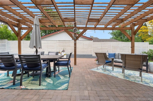 7155 E Exposition Ave, Denver, CO 80224 - fenced backyard with a patio, outdoor dining space, and a pergola