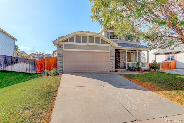 view of front of home with stone siding, a garage, fence, concrete driveway, and a front lawn