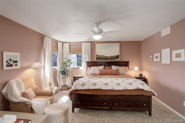 bedroom featuring light carpet, visible vents, baseboards, and a ceiling fan