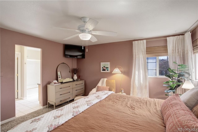 bedroom featuring ceiling fan, baseboards, and tile patterned flooring