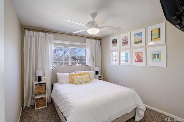 carpeted bedroom with baseboards and a ceiling fan