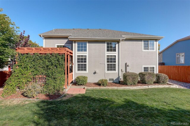 back of house featuring a yard, fence, and crawl space