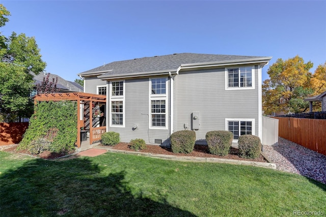 back of house featuring roof with shingles, a pergola, crawl space, a yard, and fence