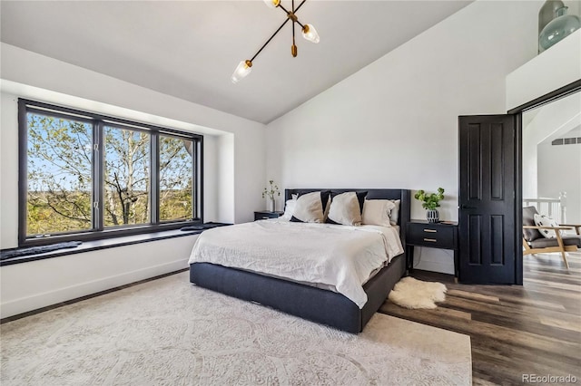 7388 S Ireland Cir, Centennial, CO 80016 - bedroom featuring wood finished floors and high vaulted ceiling
