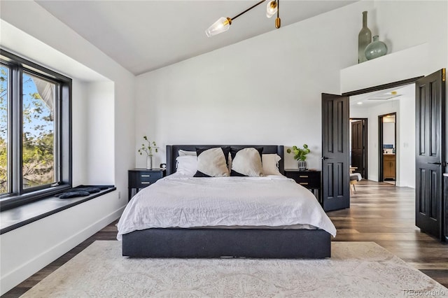 7388 S Ireland Cir, Centennial, CO 80016 - bedroom with dark wood-style flooring and lofted ceiling