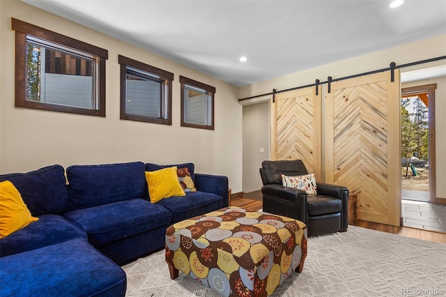 209 American Way, Breckenridge, CO 80424 - living room with a barn door, wood finished floors, and recessed lighting