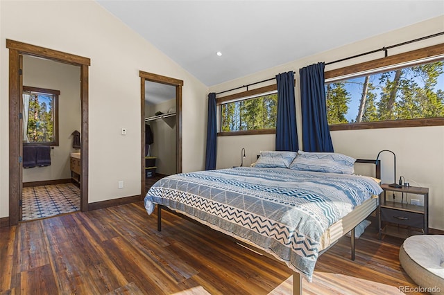 209 American Way, Breckenridge, CO 80424 - bedroom featuring hardwood / wood-style floors, vaulted ceiling, a spacious closet, a closet, and ensuite bathroom