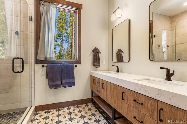 209 American Way, Breckenridge, CO 80424 - full bathroom featuring tile patterned floors, healthy amount of natural light, a shower stall, and double vanity