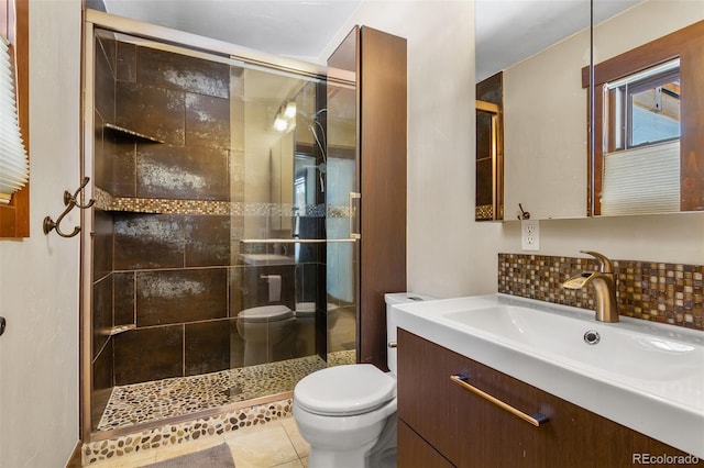 209 American Way, Breckenridge, CO 80424 - bathroom with vanity, a shower stall, tasteful backsplash, and tile patterned floors