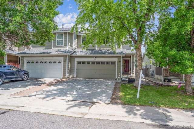 9316 Harrison St, Thornton, CO 80229 - view of front facade featuring a garage, concrete driveway, a shingled roof, and a front lawn