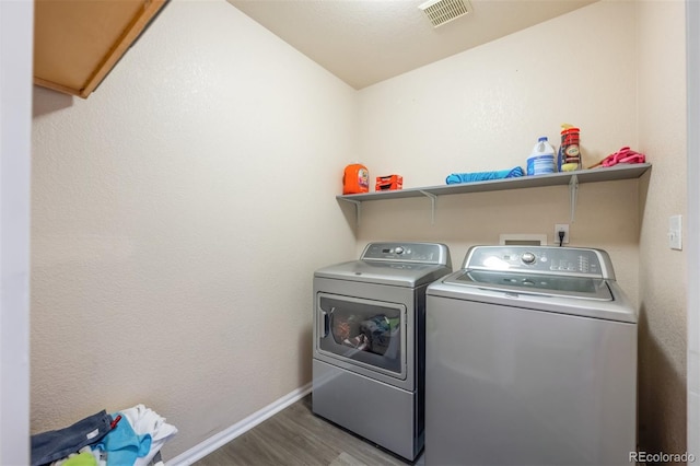 9316 Harrison St, Thornton, CO 80229 - washroom featuring washing machine and clothes dryer, wood finished floors, and baseboards