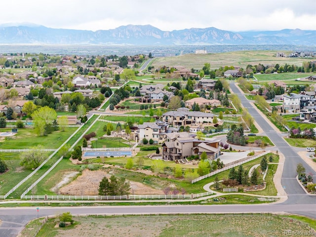 birds eye view of property featuring a mountain view