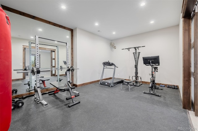 exercise area featuring recessed lighting and baseboards