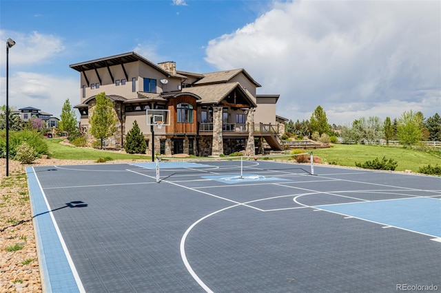 view of sport court with a yard, community basketball court, and stairway