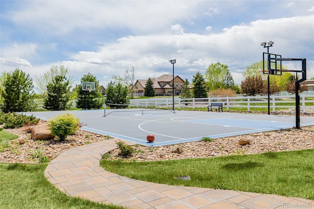 view of sport court featuring community basketball court and fence