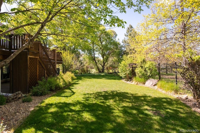 3935 Pierson St, Wheat Ridge, CO 80033 - view of yard featuring a wooden deck and stairway