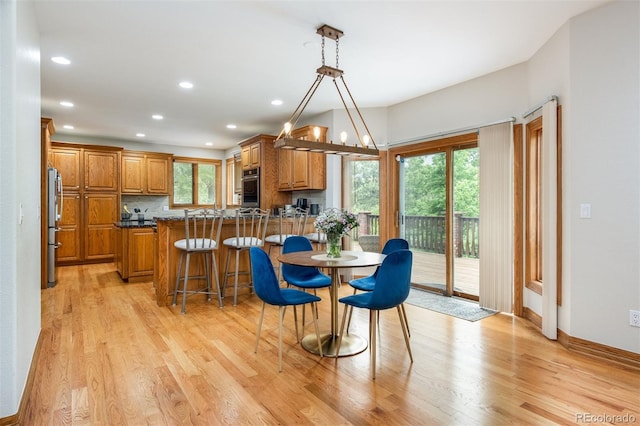 3935 Pierson St, Wheat Ridge, CO 80033 - dining area featuring healthy amount of natural light, light wood-style flooring, and recessed lighting