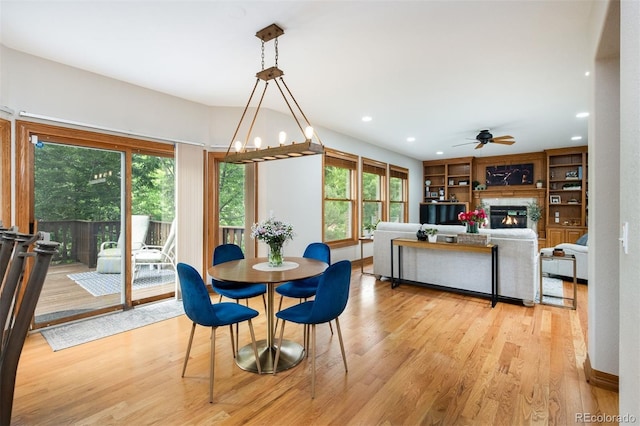 3935 Pierson St, Wheat Ridge, CO 80033 - dining space featuring ceiling fan, a glass covered fireplace, light wood-type flooring, and recessed lighting