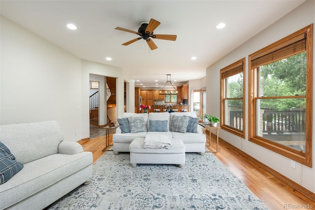 3935 Pierson St, Wheat Ridge, CO 80033 - living area with recessed lighting, light wood-type flooring, stairs, and ceiling fan