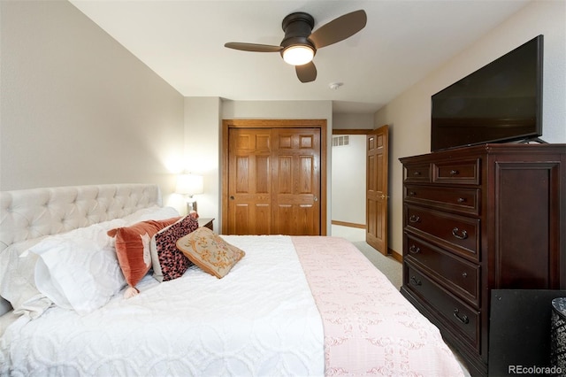 3935 Pierson St, Wheat Ridge, CO 80033 - bedroom featuring a closet, a ceiling fan, and light carpet