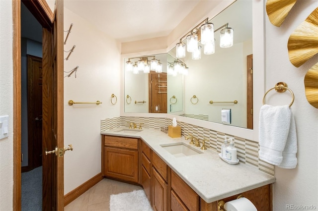 3935 Pierson St, Wheat Ridge, CO 80033 - bathroom with decorative backsplash, double vanity, and tile patterned floors