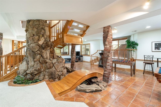 3935 Pierson St, Wheat Ridge, CO 80033 - tiled living area featuring ornate columns and stairway
