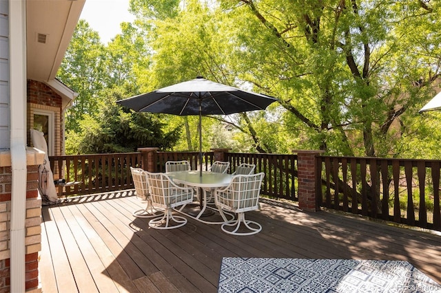 3935 Pierson St, Wheat Ridge, CO 80033 - wooden deck featuring outdoor dining area