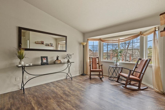 1457 Rosedale St, Castle Rock, CO 80104 - sitting room featuring wood finished floors, vaulted ceiling, and baseboards