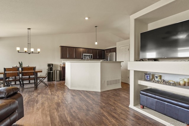 1457 Rosedale St, Castle Rock, CO 80104 - living area with lofted ceiling, dark wood-style floors, a chandelier, and baseboards