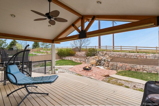 1457 Rosedale St, Castle Rock, CO 80104 - wooden terrace with a fire pit, a fenced backyard, a ceiling fan, and a patio area