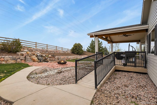 1457 Rosedale St, Castle Rock, CO 80104 - view of patio with an outdoor fire pit, ceiling fan, and a deck