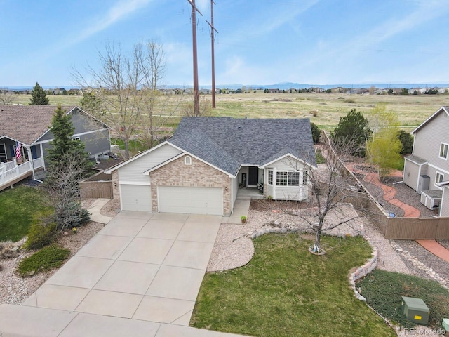1457 Rosedale St, Castle Rock, CO 80104 - ranch-style home featuring driveway, a garage, brick siding, and fence