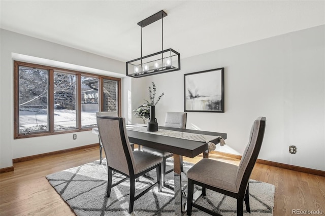 dining area featuring light wood-type flooring