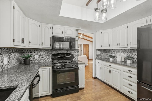 kitchen with white cabinetry and black appliances