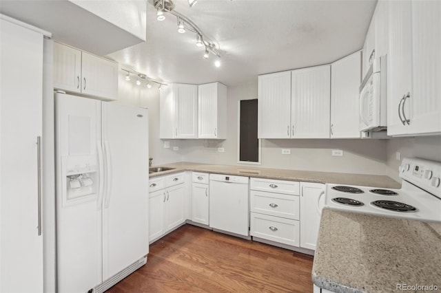 kitchen featuring light stone countertops, white appliances, sink, dark hardwood / wood-style floors, and white cabinetry