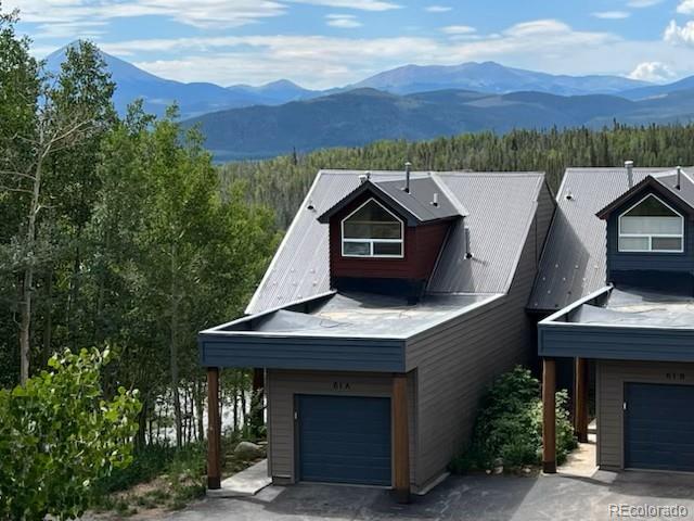 61 Cydney Ln Unit A, Silverthorne, CO 80498 - view of front of home with a mountain view and a garage