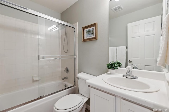 61 Cydney Ln Unit A, Silverthorne, CO 80498 - full bathroom featuring toilet, vanity, and bath / shower combo with glass door