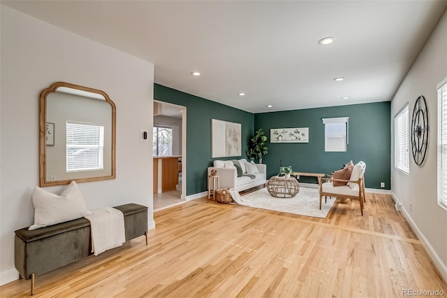 1060 Grove St, Denver, CO 80204 - living area featuring light wood finished floors and recessed lighting
