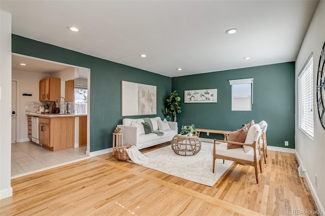 1060 Grove St, Denver, CO 80204 - living room featuring light wood-style floors and recessed lighting