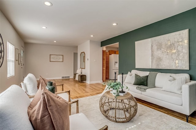 1060 Grove St, Denver, CO 80204 - living room featuring light wood finished floors and recessed lighting