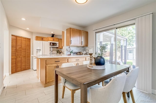1060 Grove St, Denver, CO 80204 - dining room featuring recessed lighting and baseboards